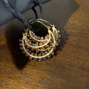 Anthropologie gold and chocolate colored hoops.